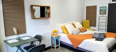 Un ou plusieurs lits dans un hébergement de l'établissement Petite maison en cœur de ville