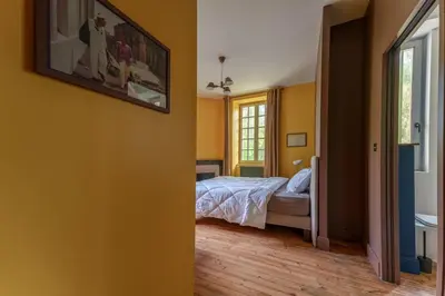 Un ou plusieurs lits dans un hébergement de l'établissement Maison 10 personnes 4 ch Bourgueil vignobles