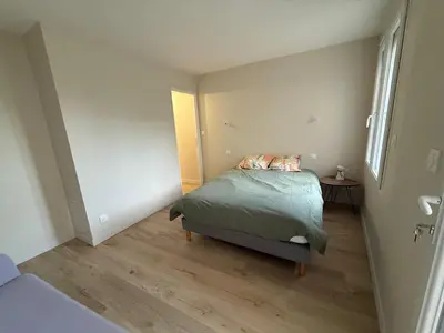 Un ou plusieurs lits dans un hébergement de l'établissement Maison 65m2
