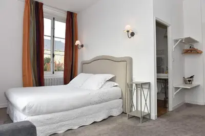 Un ou plusieurs lits dans un hébergement de l'établissement Villa des Glycines