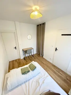 Un ou plusieurs lits dans un hébergement de l'établissement Appartement au calme, coeur de ville