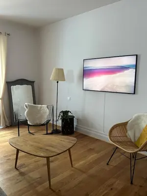 Télévision ou salle de divertissement dans l'établissement Charmant appartement au cœur de ville