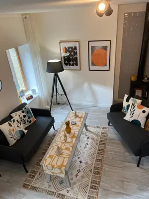 Coin salon dans l'établissement Sunshine cottages
