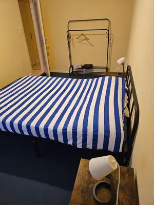 Un ou plusieurs lits dans un hébergement de l'établissement Charming 3-Bedroom Apartment in Saint-Pierre-des-Corps