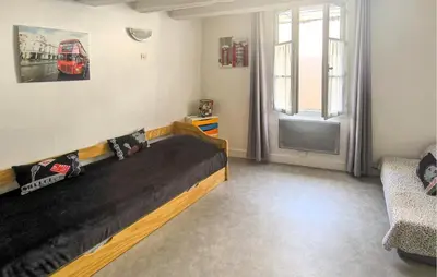Coin salon dans l'établissement Charmante Maison De Ville