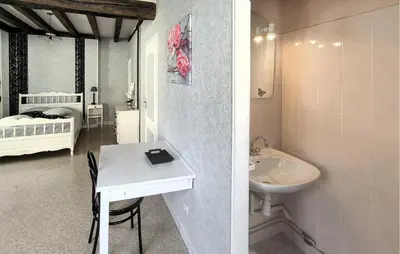 Un ou plusieurs lits dans un hébergement de l'établissement Charmante Maison De Ville