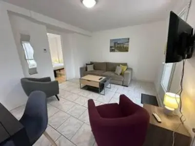 Coin salon dans l'établissement Appartement avec terrasse au centre de St Cyr