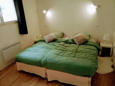 Un ou plusieurs lits dans un hébergement de l'établissement Loft avec Jardin et abri vélo