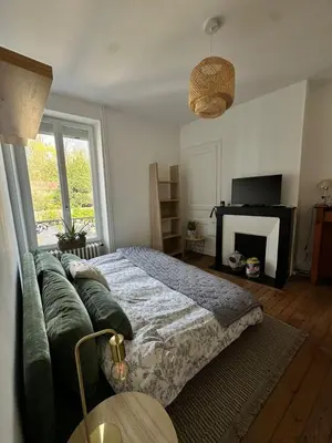 Un ou plusieurs lits dans un hébergement de l'établissement Maison conviviale terrasse & parking - 24H du Mans