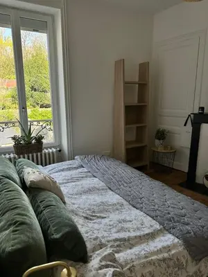 Un ou plusieurs lits dans un hébergement de l'établissement Maison conviviale terrasse & parking - 24H du Mans