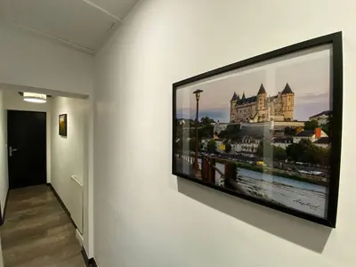 Télévision ou salle de divertissement dans l'établissement Le bois Dormant By Saumur Signature