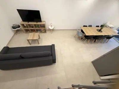 Télévision ou salle de divertissement dans l'établissement La Libellule Bleue