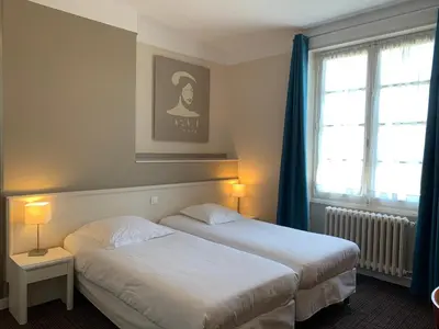 Un ou plusieurs lits dans un hébergement de l'établissement Hotel Anne De Bretagne BLOIS