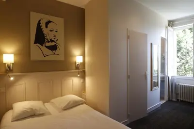 Un ou plusieurs lits dans un hébergement de l'établissement Hotel Anne De Bretagne BLOIS
