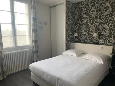 Un ou plusieurs lits dans un hébergement de l'établissement Hotel Anne De Bretagne BLOIS