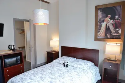 Un ou plusieurs lits dans un hébergement de l'établissement Maison du chatelain