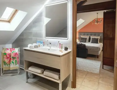 Un ou plusieurs lits dans un hébergement de l'établissement Les Aulnaies - B&B