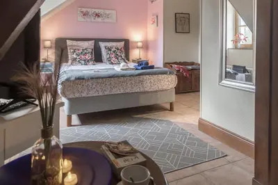 Un ou plusieurs lits dans un hébergement de l'établissement Les Aulnaies - B&B