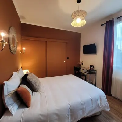 Un ou plusieurs lits dans un hébergement de l'établissement Hôtel Rive Sud