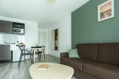 Cuisine ou kitchenette dans l'établissement City Résidence Tours