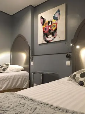 Un ou plusieurs lits dans un hébergement de l'établissement Les Terrasses de Saumur - Hôtel & Appartements - Restaurant & Spa (Logis)