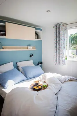 Un ou plusieurs lits dans un hébergement de l'établissement Résidence de vacances Villa Cottage