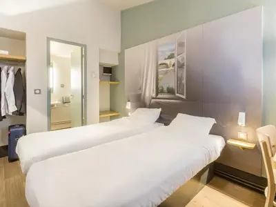 Un ou plusieurs lits dans un hébergement de l'établissement B&B HOTEL Tours Nord 1 Val de Loire