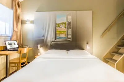 Un ou plusieurs lits dans un hébergement de l'établissement B&B HOTEL TOURS Sud Joué-lès-Tours