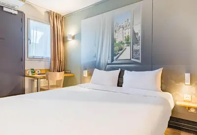 Un ou plusieurs lits dans un hébergement de l'établissement B&B HOTEL TOURS Sud Joué-lès-Tours