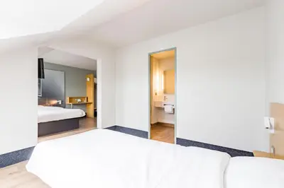 Un ou plusieurs lits dans un hébergement de l'établissement B&B HOTEL Tours Parc Expo St-Avertin