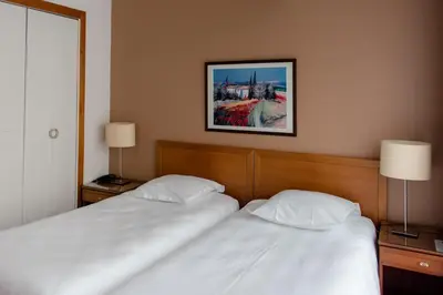 Un ou plusieurs lits dans un hébergement de l'établissement Cit'Hotel Criden
