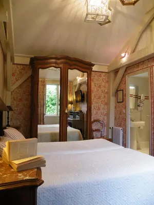 Un ou plusieurs lits dans un hébergement de l'établissement Hôtel Diderot