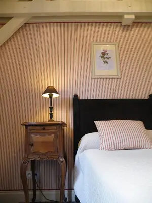 Un ou plusieurs lits dans un hébergement de l'établissement Hôtel Diderot