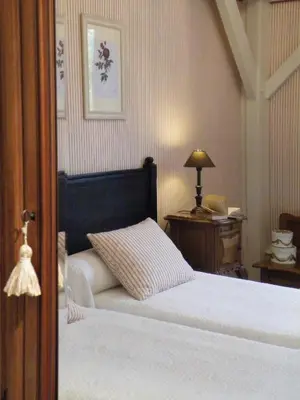 Un ou plusieurs lits dans un hébergement de l'établissement Hôtel Diderot