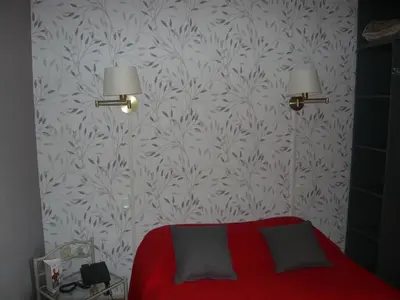 Un ou plusieurs lits dans un hébergement de l'établissement Cit'Hôtel - Restaurant Saint Jacques