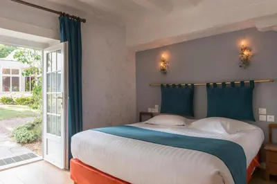 Un ou plusieurs lits dans un hébergement de l'établissement Le Relais Des Landes - Demeures et Chateaux