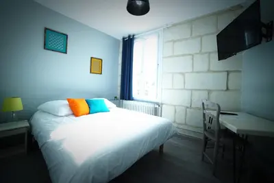 Un ou plusieurs lits dans un hébergement de l'établissement Hotel de la gare
