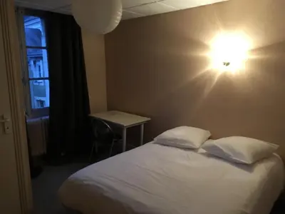Un ou plusieurs lits dans un hébergement de l'établissement Hotel de la gare