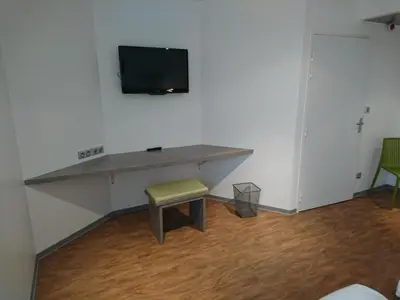 Télévision ou salle de divertissement dans l'établissement H24 HOTEL