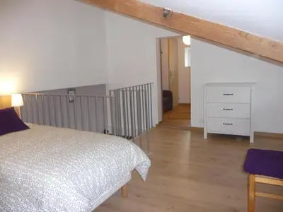 Un ou plusieurs lits dans un hébergement de l'établissement Gite 4* L'Orée des Fleurs