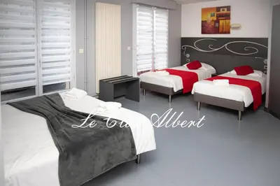 Un ou plusieurs lits dans un hébergement de l'établissement Le Clos Albert