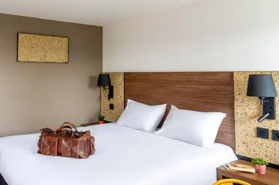Un ou plusieurs lits dans un hébergement de l'établissement greet Hotel Chatellerault