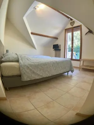 Un ou plusieurs lits dans un hébergement de l'établissement Beauval Chambre