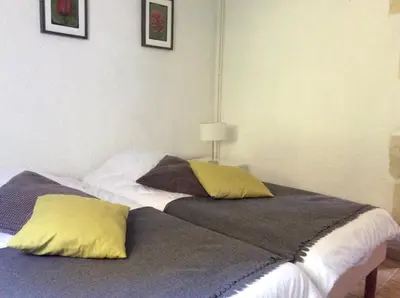 Un ou plusieurs lits dans un hébergement de l'établissement Gîte Ô Beauval