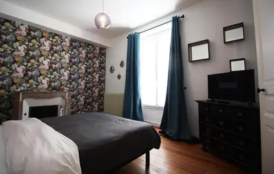 Un ou plusieurs lits dans un hébergement de l'établissement Appartements Plantagenet - Le 27