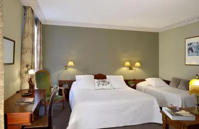 Un ou plusieurs lits dans un hébergement de l'établissement Hôtel Du Manoir