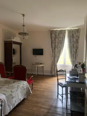Télévision ou salle de divertissement dans l'établissement Moulin d'Amour