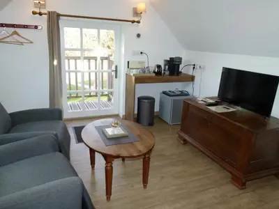 Télévision ou salle de divertissement dans l'établissement Le Grand Saint-Marc