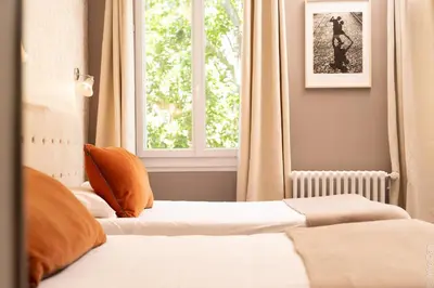 Un ou plusieurs lits dans un hébergement de l'établissement Hotel Mirabeau
