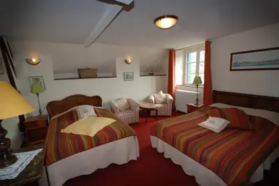 Un ou plusieurs lits dans un hébergement de l'établissement Logis Cote Loire - Auberge Ligerienne